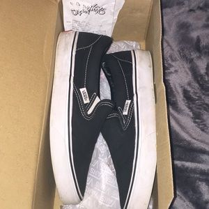 black and white slip on vans